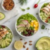 Colorful chicken salad bowls with fresh ingredients, showing easy 15-minute healthy meal ideas